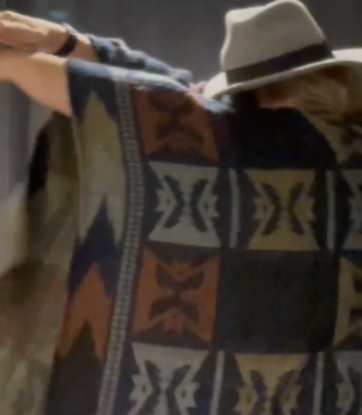 Geordie from Eavesdroppin' in a poncho